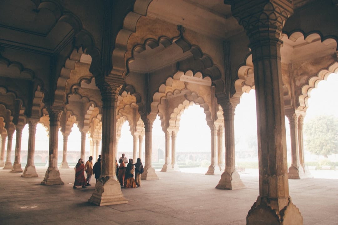 Travelers in an Indian heritage setting illustrating the human tradition of pilgrimage